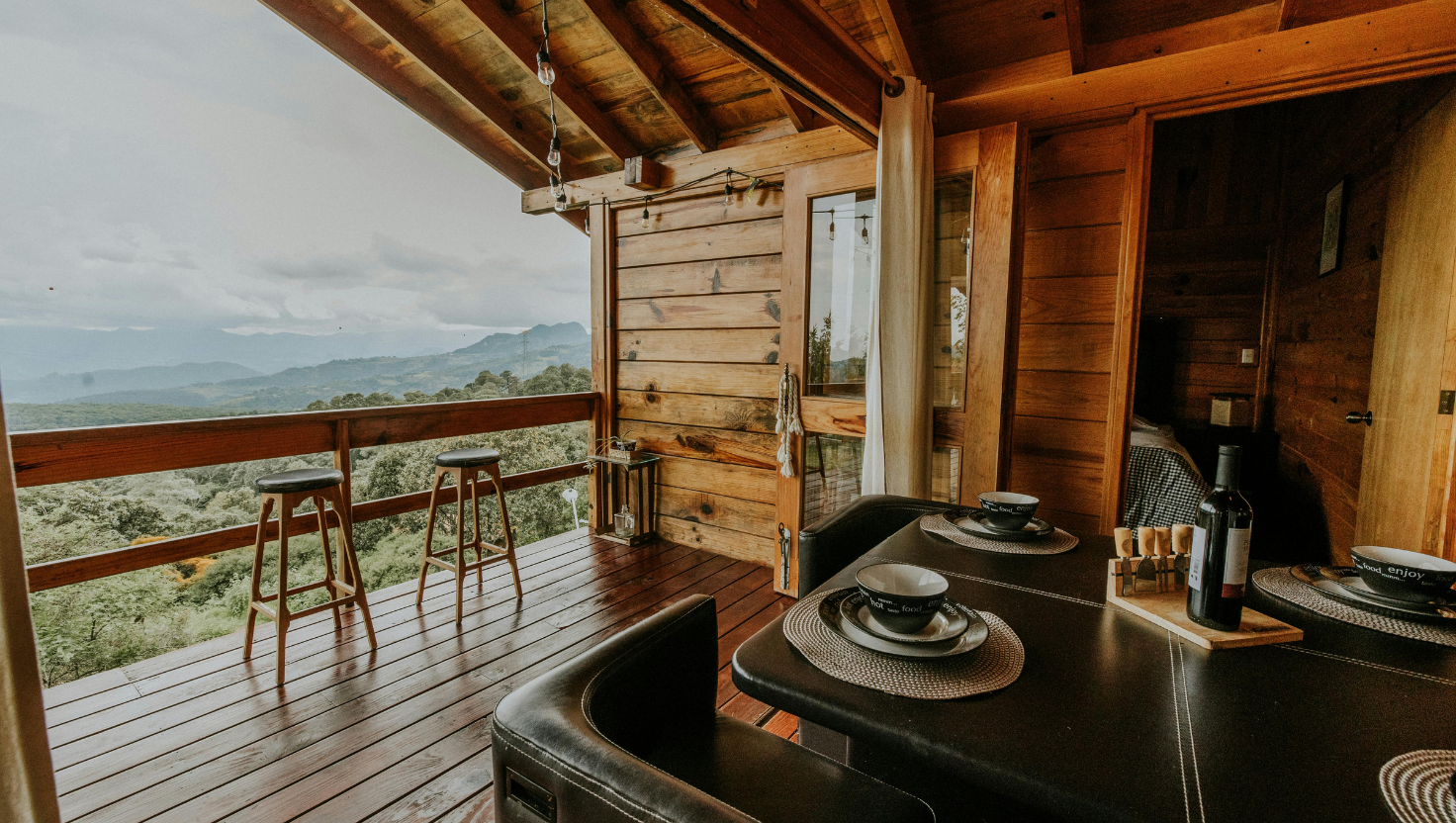 Photo of a mountain-view cabin exterior, symbolizing hospitality operators moving from LiveRez to Jurny’s Agentic AI OS for autonomous operations.